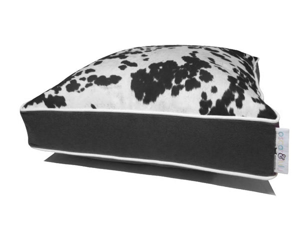 Black & cream faux cow hide dog bed, black sides & bottom with cream piping