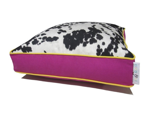 Black & cream faux cow hide dog bed, hot pink sides & bottom with yellow piping