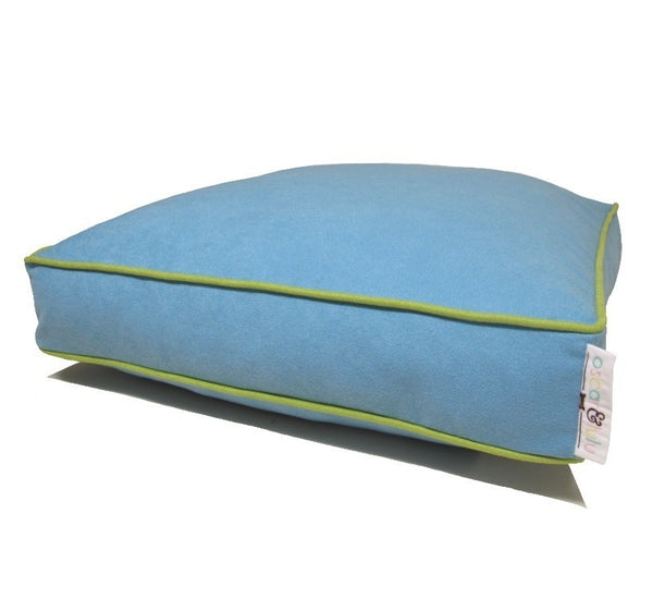 Light blue dog bed with light green piping